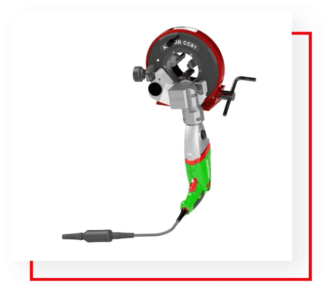 An electric drill with a red and green handle.