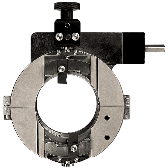 Circular welding alignment tool on black background.
