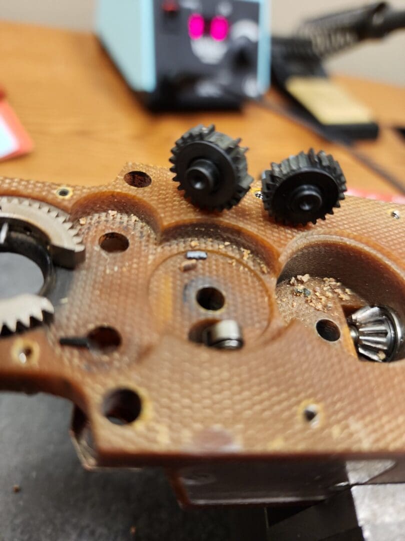 Gear debris inside an orbital weld head housing